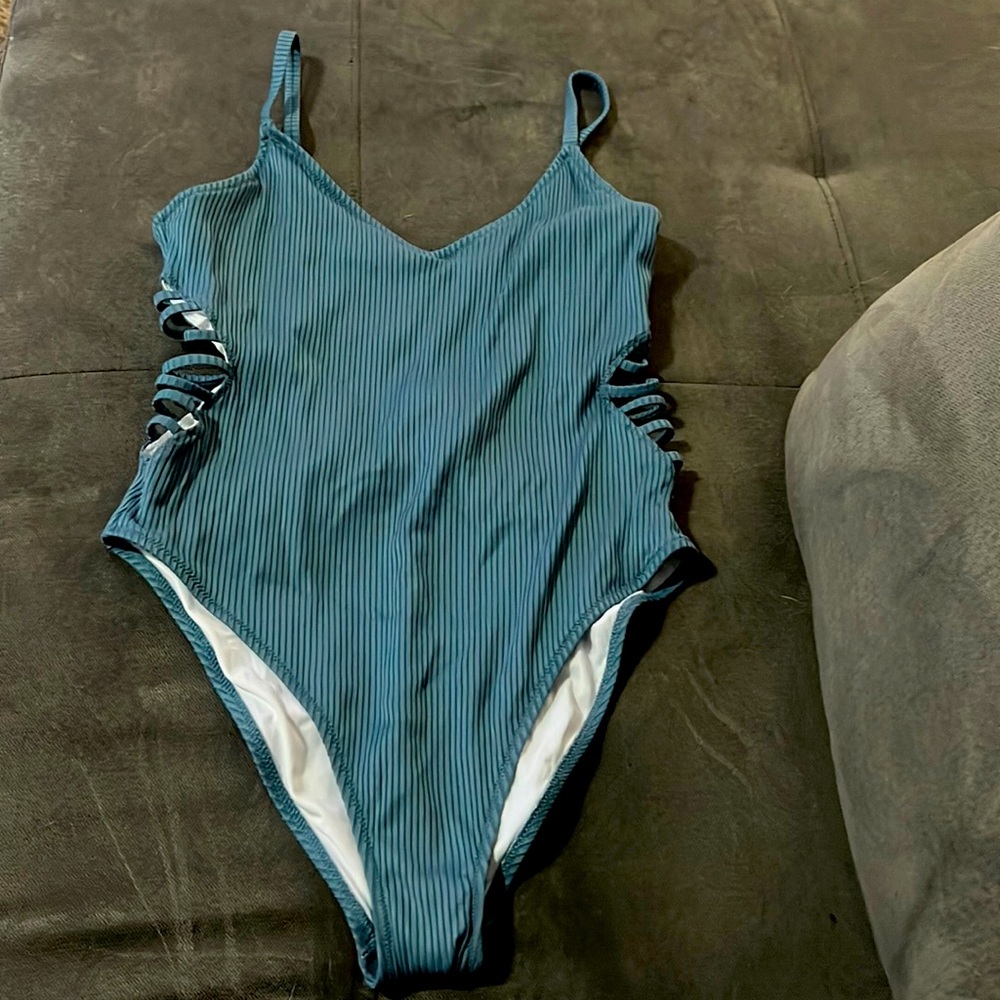 This is a blue swimsuit in a size large from pink and it has never been worn.